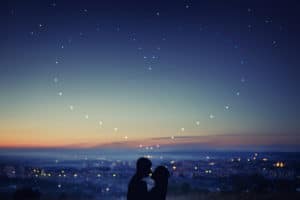 Night sky, city view, with stars in the shape of a heart
