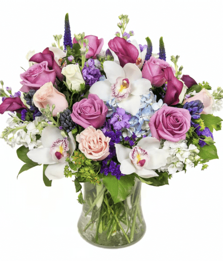 Beautiful and lush design of blooms including hydrangea, roses, orchids & more.